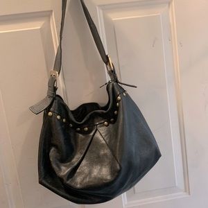 Black shoulder bag with brass details